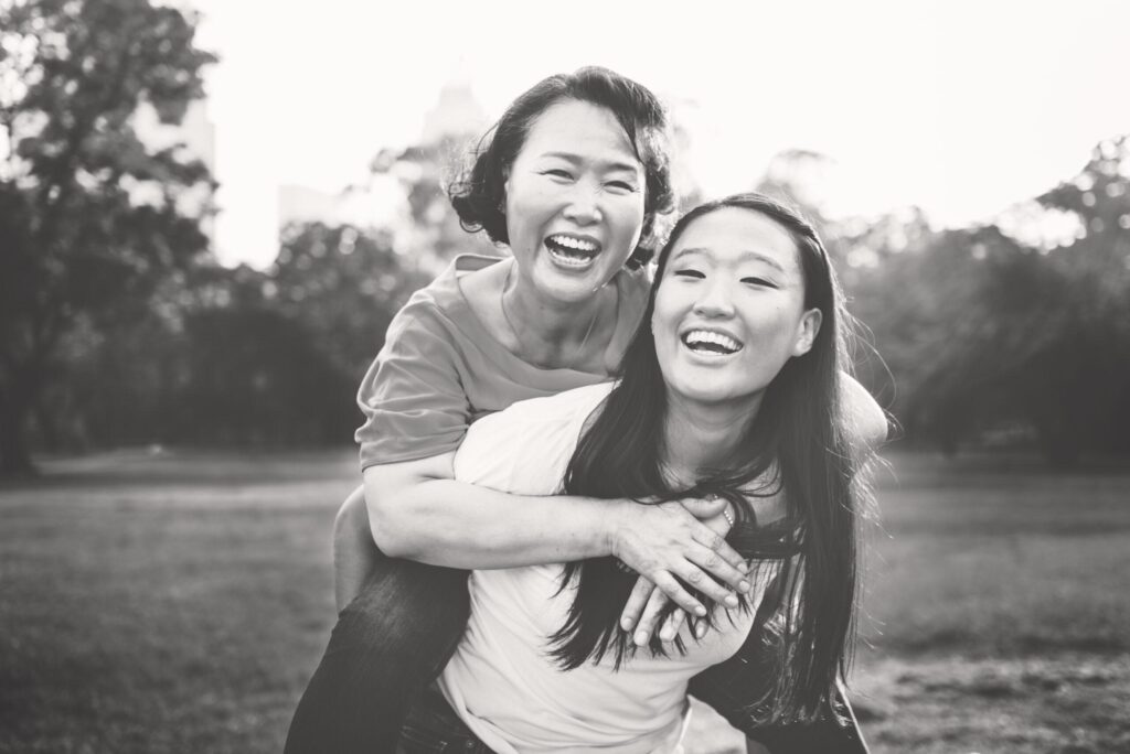 teen girl & her mom experiencing joy