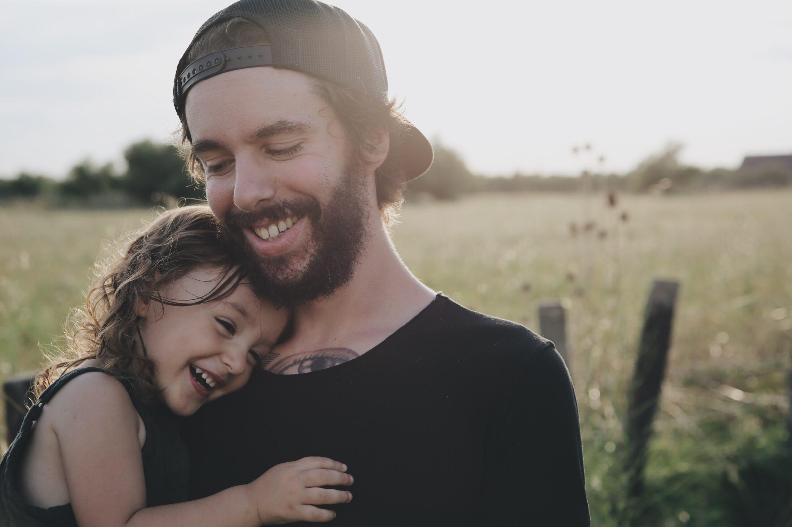 dad and child, hugging and laughing; resources for dads