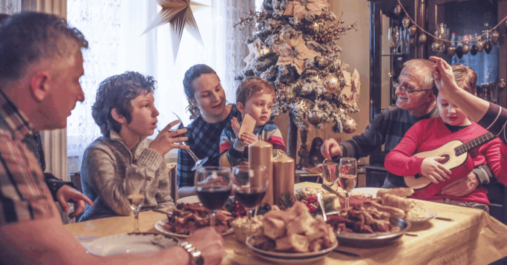 kids, parents and grandparents enjoy a Christmas dinner together even in the midst of chaos