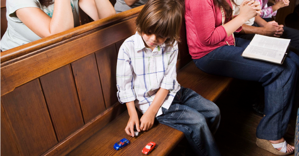 Getting Kids to Behave in Church 2 kid in church playing quietly with toys