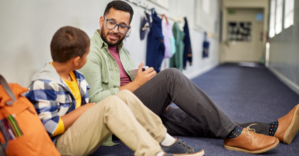 teacher fostering responsibility in the classroom, talking to a student privately about how they can repair and make things right