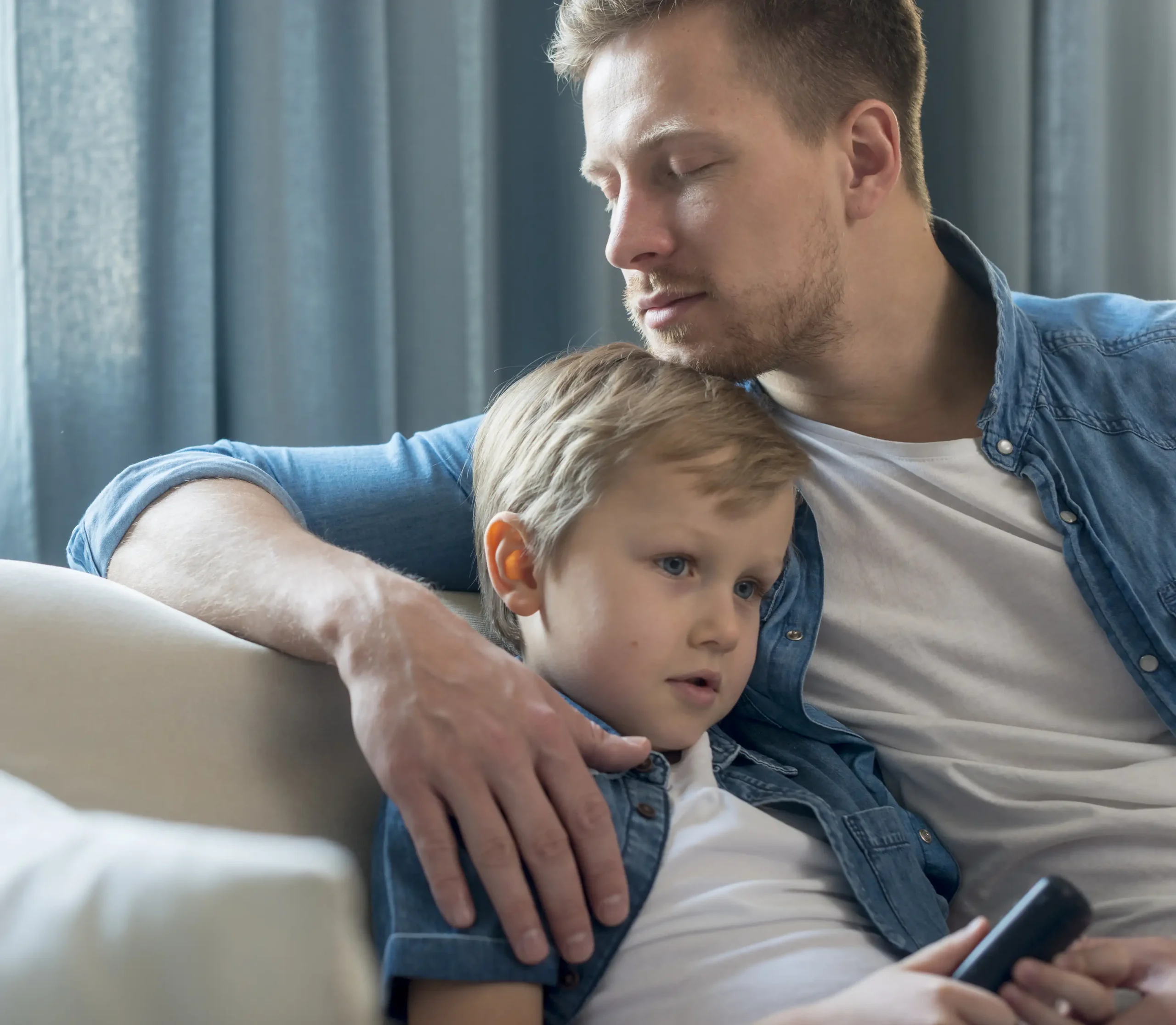 father-s-day-dad-son-sitting-couch copy
