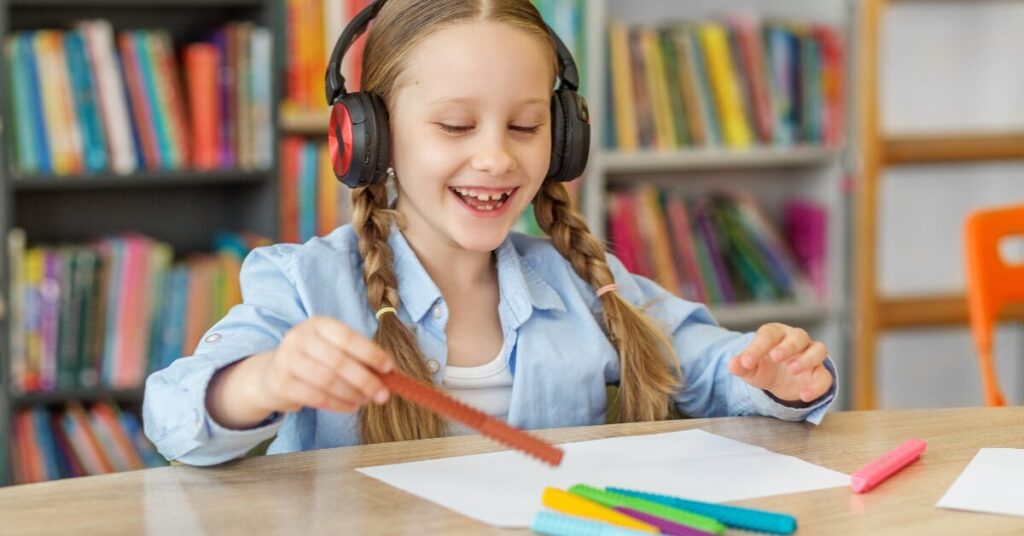 child accommodations at school - girl wearing headphones, advocating for your neurodivergent child at school 