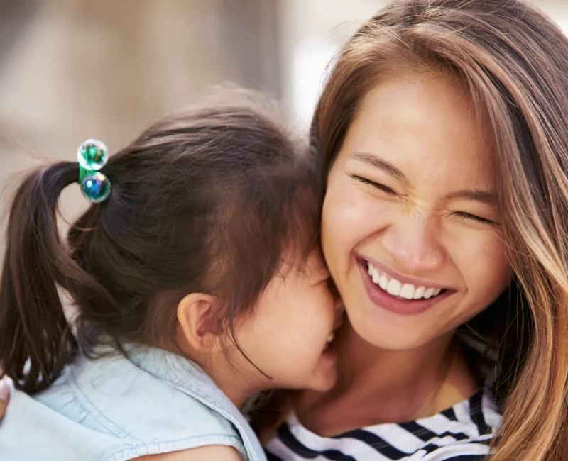 Girl Laughing with Mom