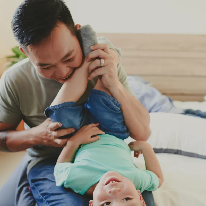 dad-playing-with-son_1x