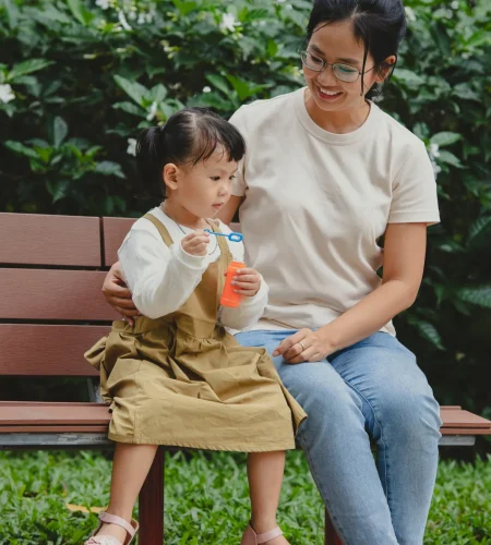 full-shot-mother-girl-sitting-bench_1x