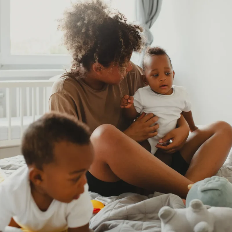 mother-holding-cute-baby-full-shot_1x