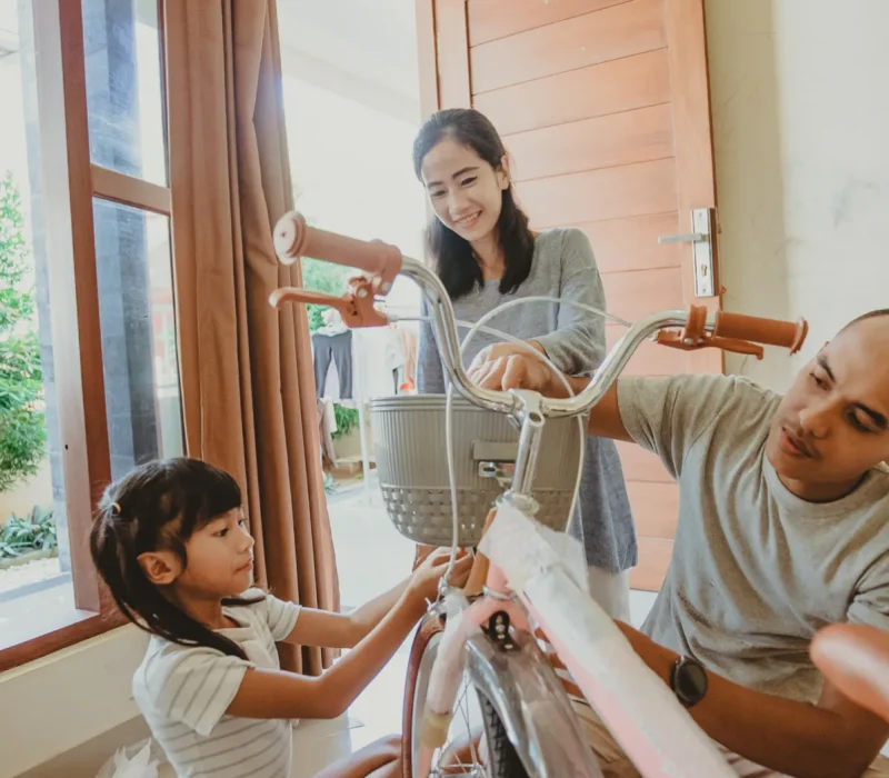 togetherness-father-mother-daughter-installing-basket_1x
